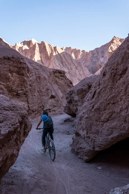 Biking through Devil's Throat in the Atacama Desert